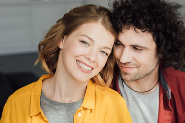 portrait of beautiful happy young couple at home