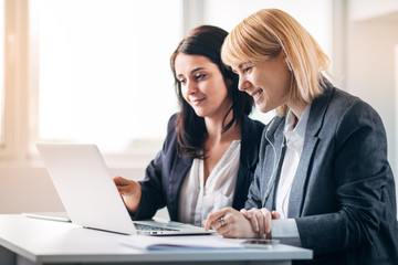 Colleagues working in office