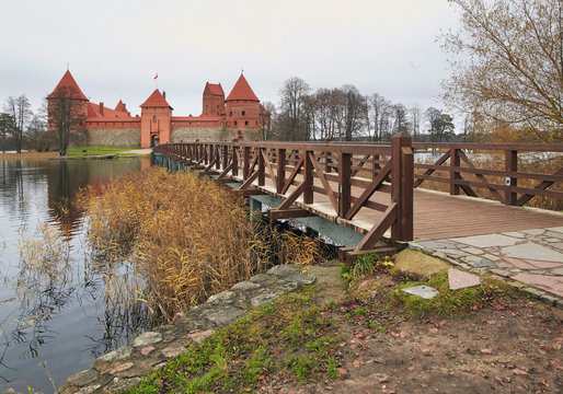 Trakai, Lithuania - November 7, 2017: Trakai Castle with a wooden bridge on the lake.