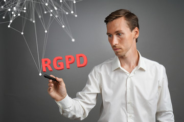 RGPD, Spanish, French and Italian version version of GDPR: Reglamento General de Proteccion de datos. General Data Protection Regulation. Young man working with information.
