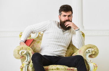 Connoisseur of literature concept. Macho spends leisure with book. Connoisseur, on thoughtful face...