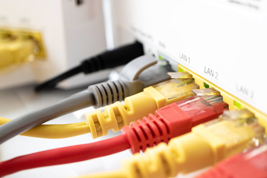 multi-colored copper cords patch for home internet connected to the router. for each device its own color