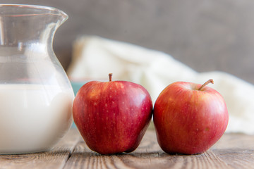 a jug of milk, apples and porridge