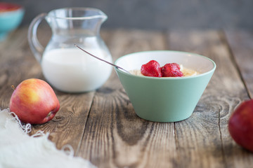 a jug of milk, apples and porridge