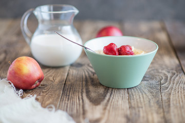 a jug of milk, apples and porridge
