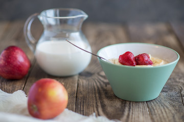 a jug of milk, apples and porridge