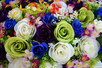 Fake flower and Floral background. rose flowers made of fabric. The fabric flowers bouquet. Colorful of decoration artificial flower