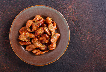 Spicy turkey fillet pieces on plate