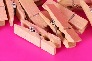 a heap of wooden clothespins are lying in the pink studio