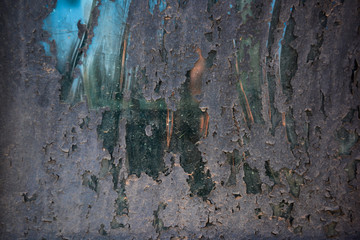 Grunge background of glass with peeling paint