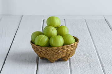 Indian gooseberry on wooden table