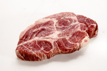 slice of raw pork neck on white background