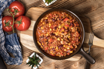 Chili con carne in a clay pan.