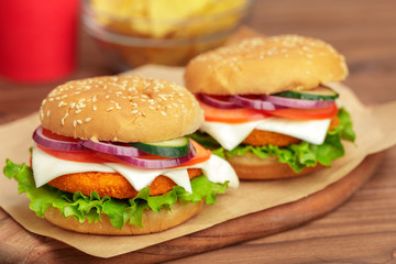 Fast food, homemade burger on a wooden background