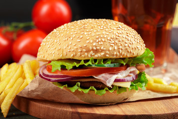 Fast food, homemade burger on a wooden background