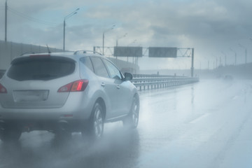 Drive car in rain on asphalt wet road. Clouds without sun - 201486940