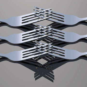 Close up of forks with tines criss-crossed each other