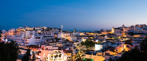 Panoramic, night view of the Old Town of Albufeira City in Algarve, Portugal. Albufeira is a...