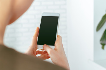 close up of woman texting on smartphone