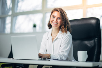 Young woman in office