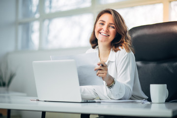 Young woman in office