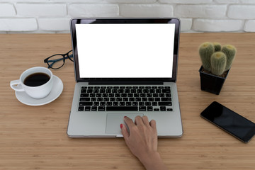 Woman hand with computer laptop on wood table.