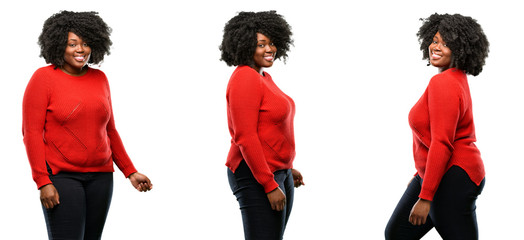 Young beautiful african plus size model sticking out tongue at camera at sign of disobedience,...