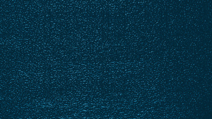 Shiny metallized dark turquoise foil textured surface for background
