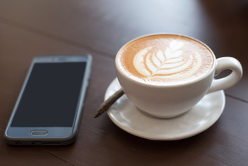 coffee cup latte art. Hot coffee cappuccino latte art. A Cup of hot latte art coffee on wooden table, 