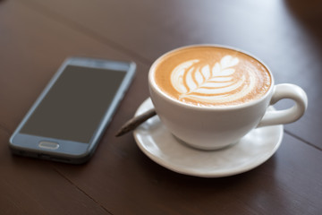 coffee cup latte art. Hot coffee cappuccino latte art. A Cup of hot latte art coffee on wooden table, 