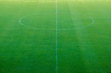 Obraz premium Green grass at a football stadium sports background.