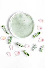 breakfast plate with petals and eucalyptus on white background t