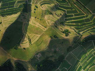full frame shot of agricultural fields and hills from bird eye view, europe