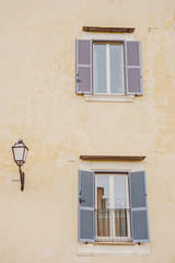 windows with open shutters in Castel Gandolfo, Rome suburb, Italy