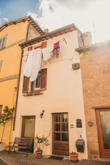 Fototapeta na wymiar clothes drying outside building in Orvieto, Rome suburb, Italy
