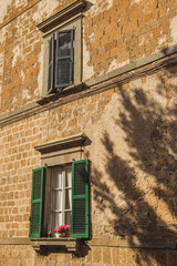 tree shadow on building in Orvieto, Rome suburb, Italy