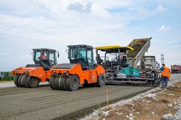 Road construction, asphalt concrete paving