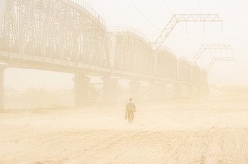 Man walking in a sandstorm