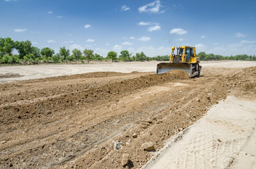 The bulldozer level the ground