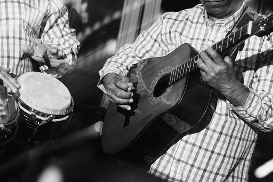 musician playing guitar in in the night club