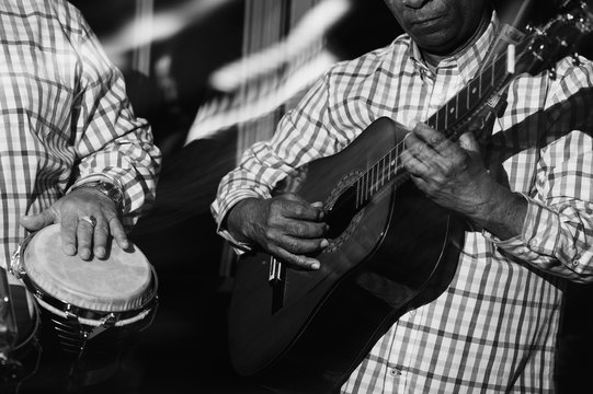 musician playing guitar in in the night club