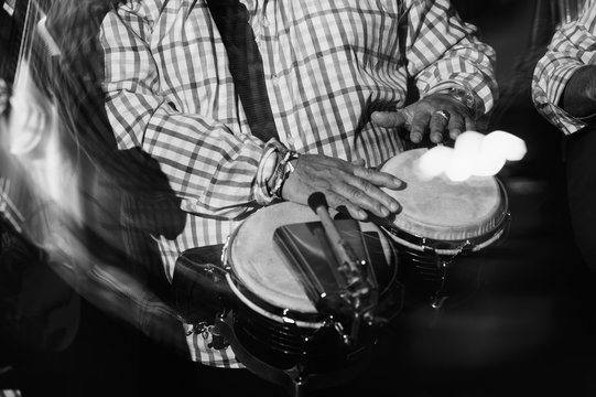 musician playing drums in in the night club