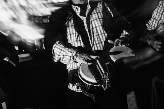 musician playing drums in in the night club