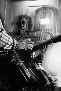 musician playing guitar in in the night club