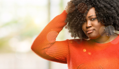 Beautiful african woman doubt expression, confuse and wonder concept, uncertain future, outdoor