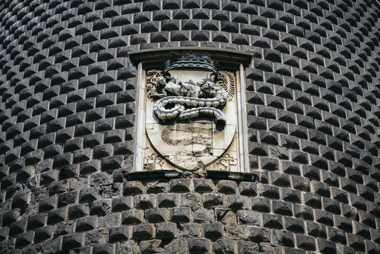 Closeup windows and emblem details of Sforza Castle, one of the main landmarks and tourist attractions of Milan, Italy