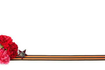 Concept background of May 9 russian holiday Victory Day. Red carnations, St. George's ribbon and order of the Red Star