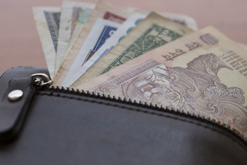 Banknotes put into wallet