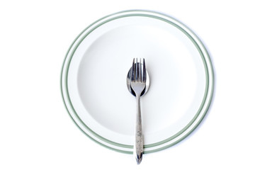 Spoon and Fork on plate, isolated on white background
