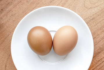chicken eggs on wooden on wooden background